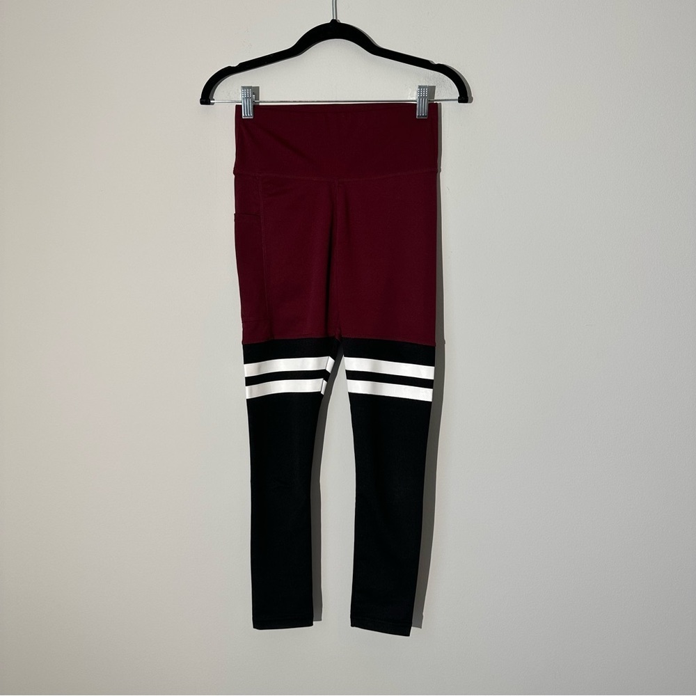 Burgundy and black leggings with white stripes and pockets size XS